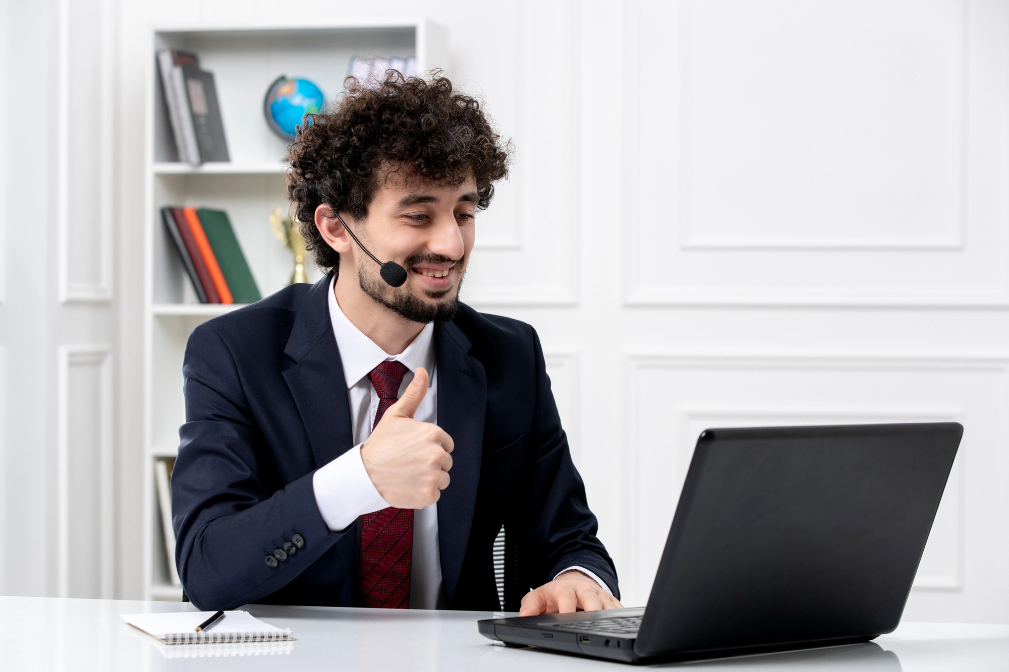 customer-service-handsome-young-guy-office-suit-with-laptop-headset-smiling-happily
